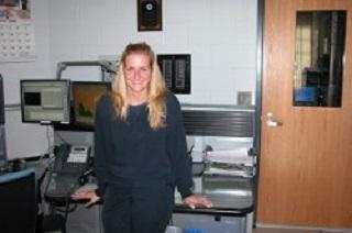 Dispatcher standing in Public Communications office